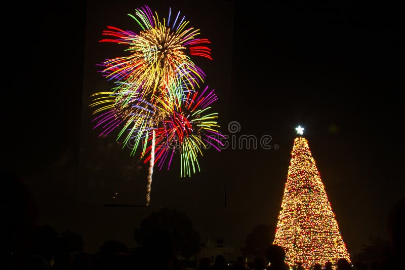 People gathered to celebrate christams and new year enjoy fireworks and huge Christmas tree decoration on Christmas Eve. Nagoya port, Aichi, Japan. People gathered to celebrate christams and new year enjoy fireworks and huge Christmas tree decoration on Christmas Eve. Nagoya port, Aichi, Japan.