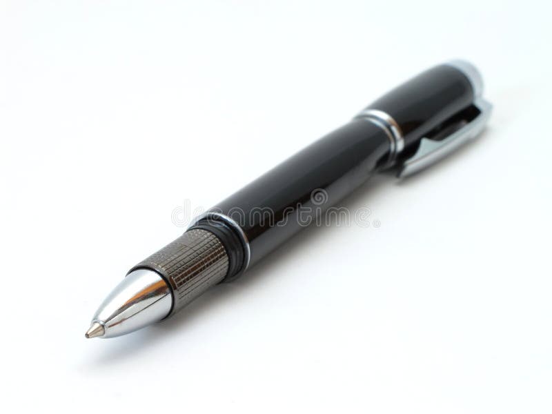 An uncapped pen on a white background. Slanted with shallow depth of field. With shadows. An uncapped pen on a white background. Slanted with shallow depth of field. With shadows.