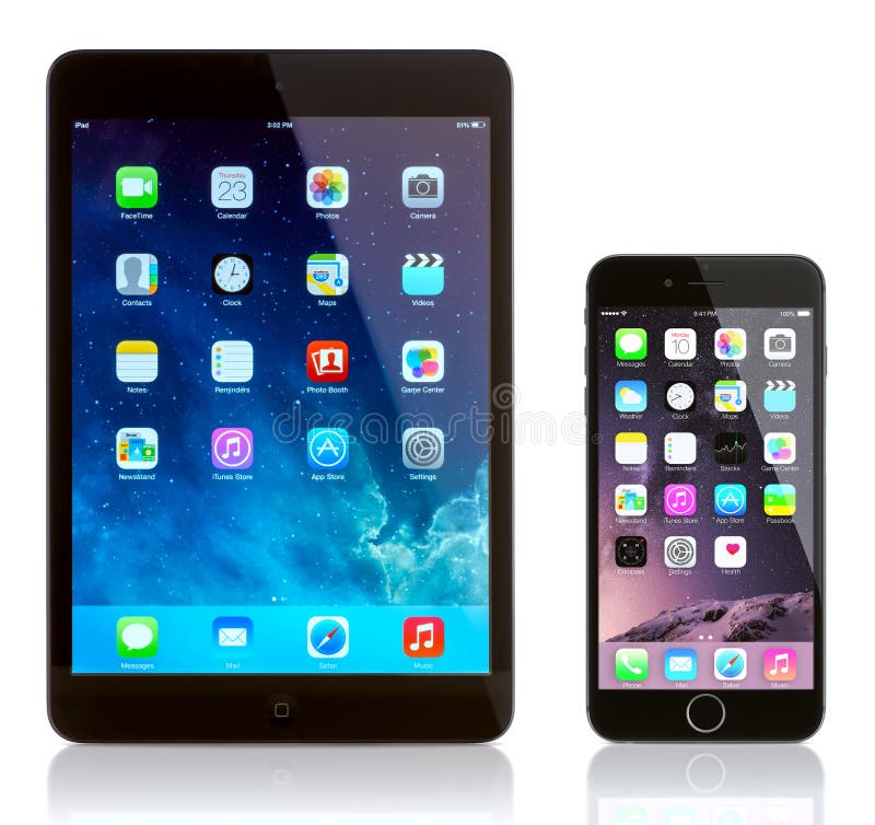 iPad Mini and iPhone 6 on white. Apple iOS 8 applications on the home screen of the iPhone 6 and iPad. iPad Mini and iPhone 6 on white. Apple iOS 8 applications on the home screen of the iPhone 6 and iPad.