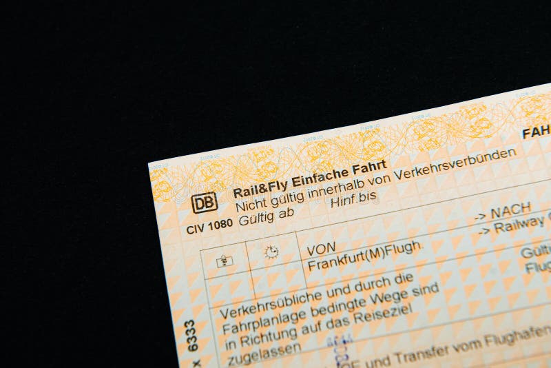 Germany - Jan 2, 2018: Close-up detail of Rail And Fly Single ticket offered by DB Deutsche bahn German railways with start destination from Frankfurt am Main. Germany - Jan 2, 2018: Close-up detail of Rail And Fly Single ticket offered by DB Deutsche bahn German railways with start destination from Frankfurt am Main