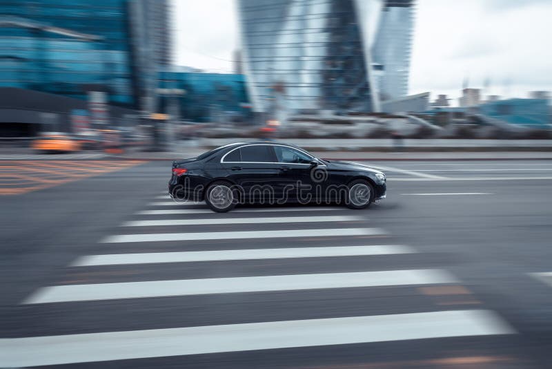 Moscow , Russia - May 2021: Fast moving Mercedes E Class W213 Facelift on a city road. Shiny premium Mercedes-Benz E-Class in motion, side view. Moscow , Russia - May 2021: Fast moving Mercedes E Class W213 Facelift on a city road. Shiny premium Mercedes-Benz E-Class in motion, side view