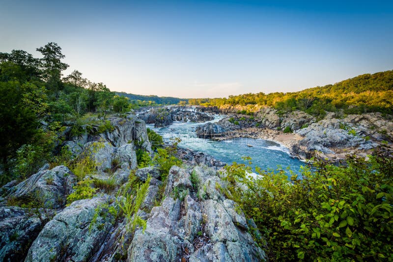 View of rapids in the Potomac River at sunset, at Great Falls Park, Virginia. View of rapids in the Potomac River at sunset, at Great Falls Park, Virginia.