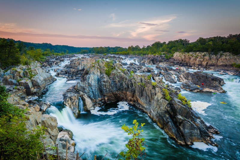 View of rapids in the Potomac River at sunset, at Great Falls Park, Virginia. View of rapids in the Potomac River at sunset, at Great Falls Park, Virginia.