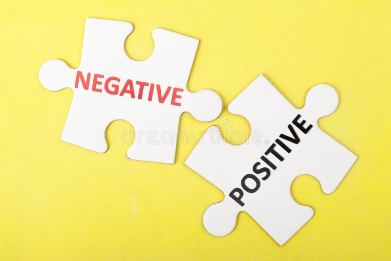 Negative versus positive concept on two pieces of jigsaw puzzles. Negative versus positive concept on two pieces of jigsaw puzzles