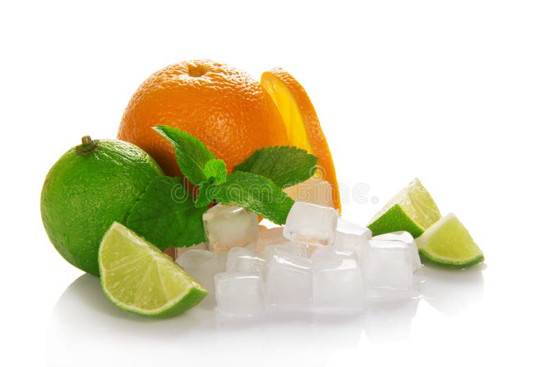 Ripe orange and juicy green lime, mint and the cubes of ice isolated on the white. Ripe orange and juicy green lime, mint and the cubes of ice isolated on the white