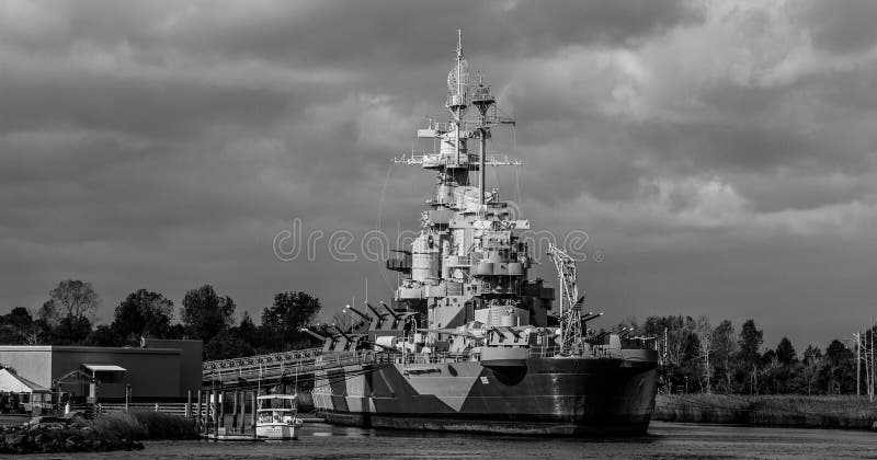 Storm clouds roll in behind the Battleship North Carolina in Wilmington, NC. Storm clouds roll in behind the Battleship North Carolina in Wilmington, NC.