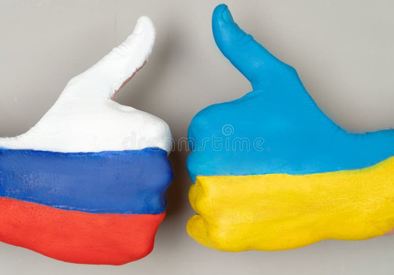 Thumb up hand of hands with the drawing of a flag of Ukraine and Russia. Thumb up hand of hands with the drawing of a flag of Ukraine and Russia.