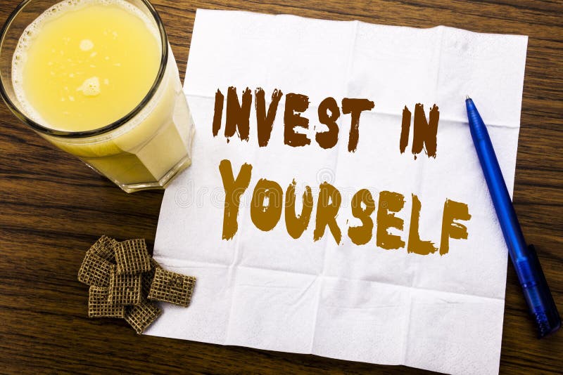 Handwriting Announcement text showing Invest In Yourself. Business concept for Self Motivation written on tissue paper on wooden background with pen and healthy juice in the restaurant. Handwriting Announcement text showing Invest In Yourself. Business concept for Self Motivation written on tissue paper on wooden background with pen and healthy juice in the restaurant