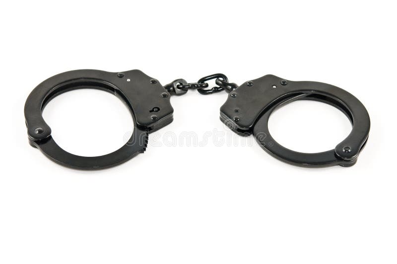 A pair of black steel handcuffs, isolated on white. A pair of black steel handcuffs, isolated on white