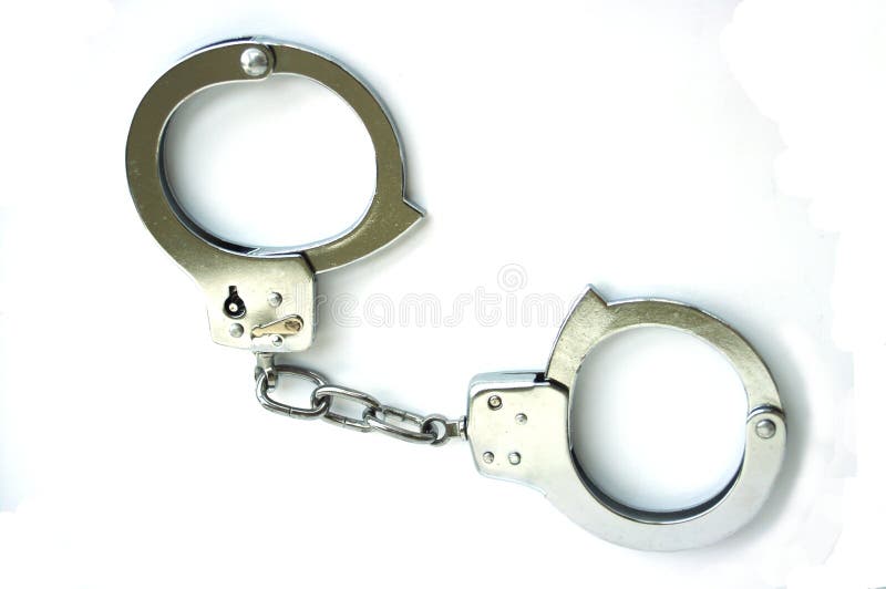 Empty metal handcuffs. Isolated on a white background. Empty metal handcuffs. Isolated on a white background