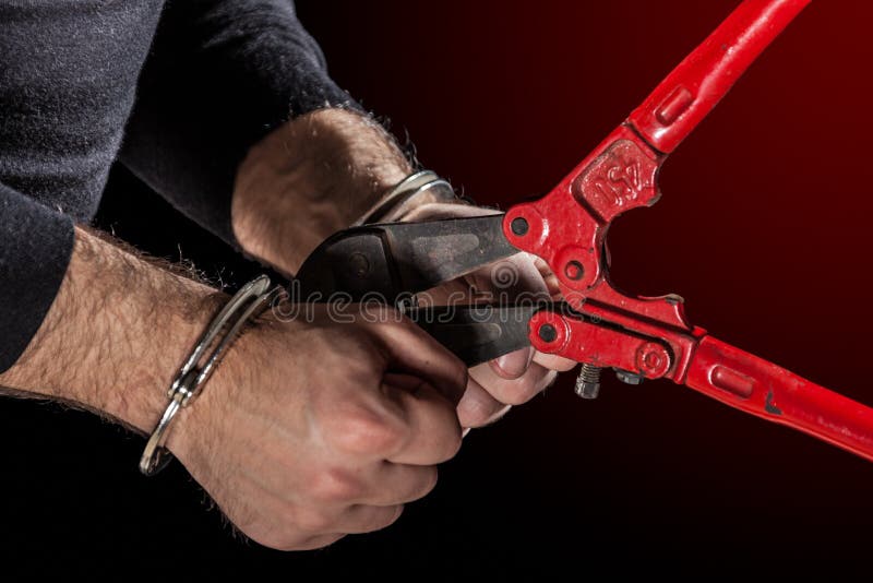 Criminals that try to break handcuffs with a big pair of shears. Criminals that try to break handcuffs with a big pair of shears