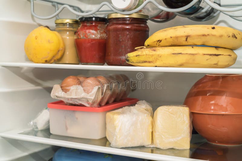 Open fridge with usual daily food of average man. Open fridge with usual daily food of average man