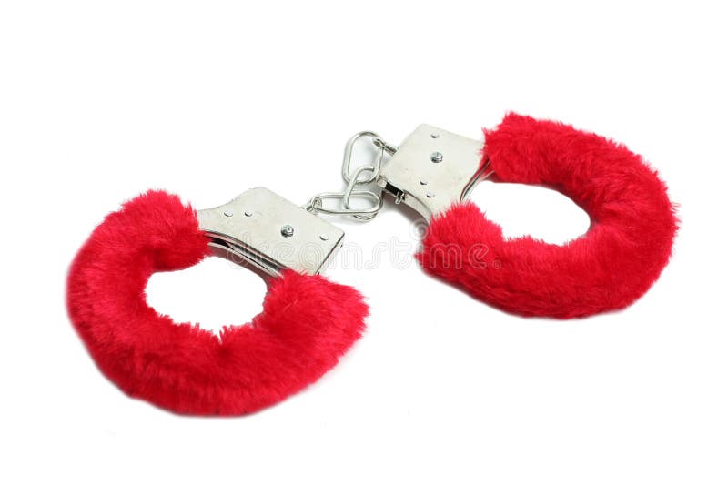 Red sexual handcuffs sexshop isolated on white background. Red sexual handcuffs sexshop isolated on white background