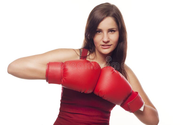 Pretty confident young woman with boxing gloves. Pretty confident young woman with boxing gloves