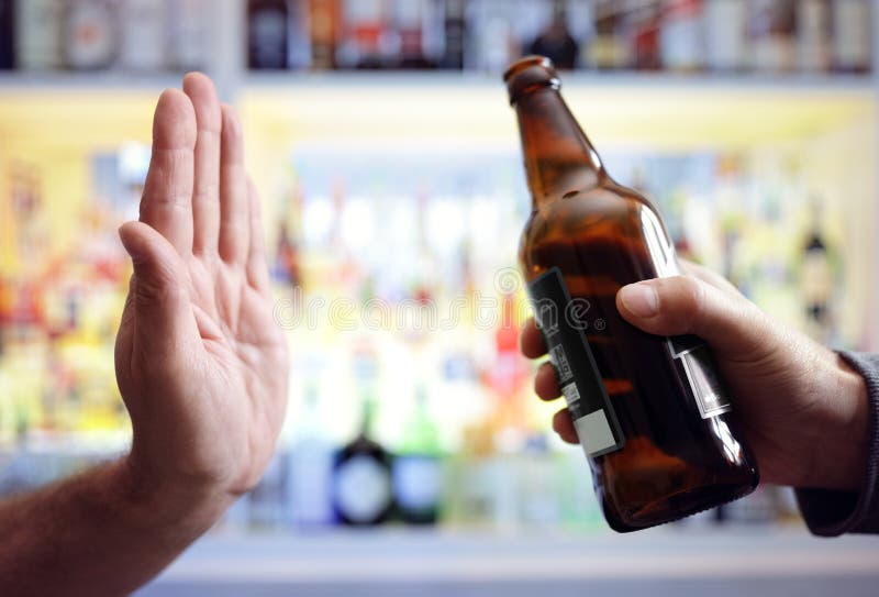 Hand rejecting alcoholic beer beverage concept for alcoholism and addiction. Hand rejecting alcoholic beer beverage concept for alcoholism and addiction