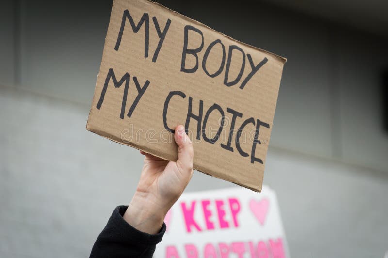 Person holding a pro-choice sign overhead during a pro choice Planned Parenthood demonstration. Person holding a pro-choice sign overhead during a pro choice Planned Parenthood demonstration