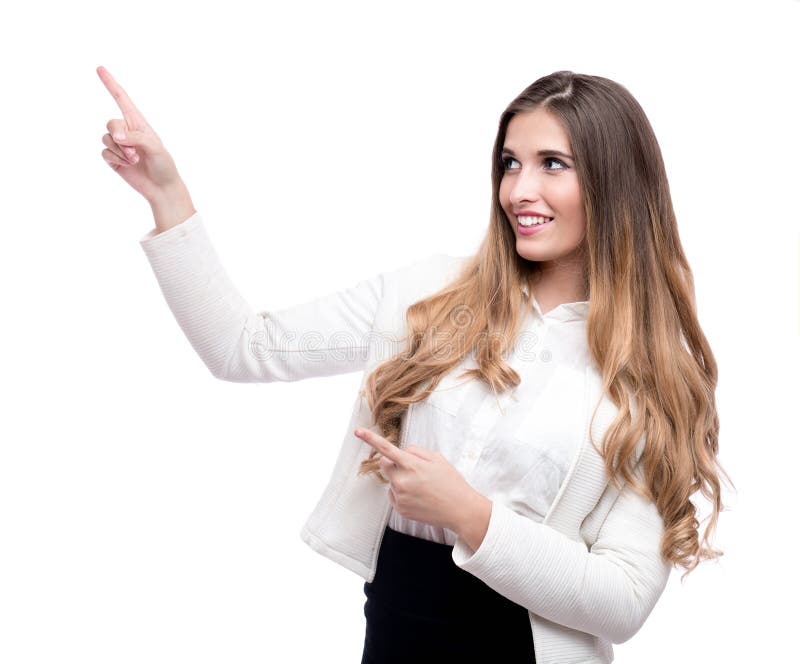 指向在某事的愉快的美丽的女实业家隔绝在白色背景 免版税图库摄影