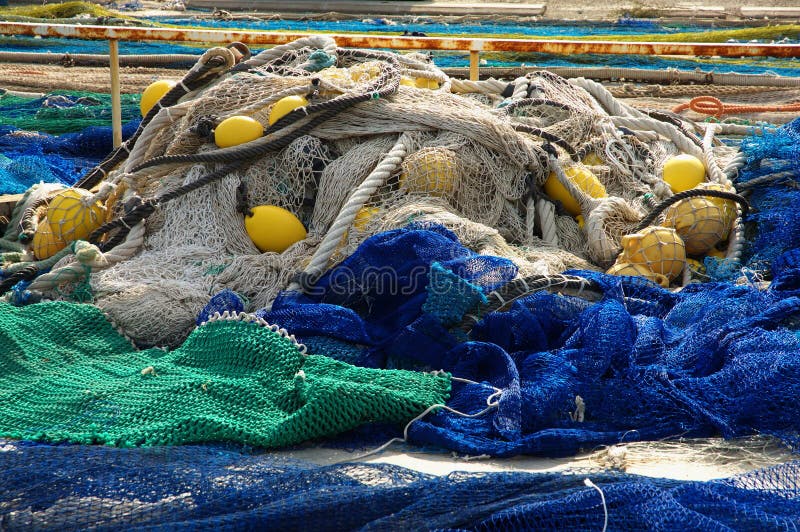 Blue and green fishing nets. Blue and green fishing nets