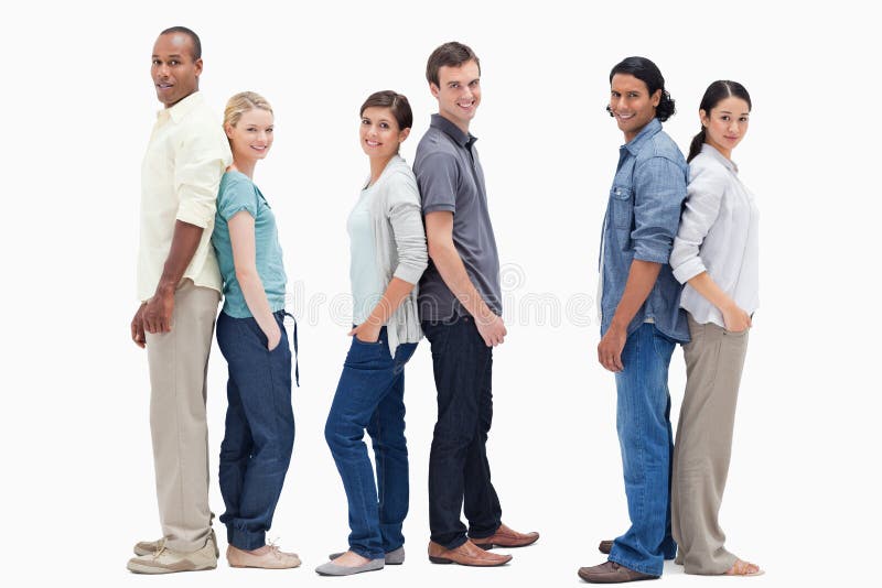 Three couples standing back to back against white background. Three couples standing back to back against white background