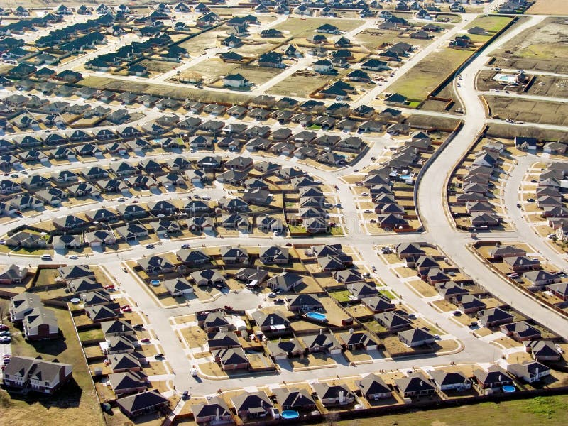 This new housing development, visible from the air on approach to the airport, illustrates urban sprawl and suburban growth. This new housing development, visible from the air on approach to the airport, illustrates urban sprawl and suburban growth