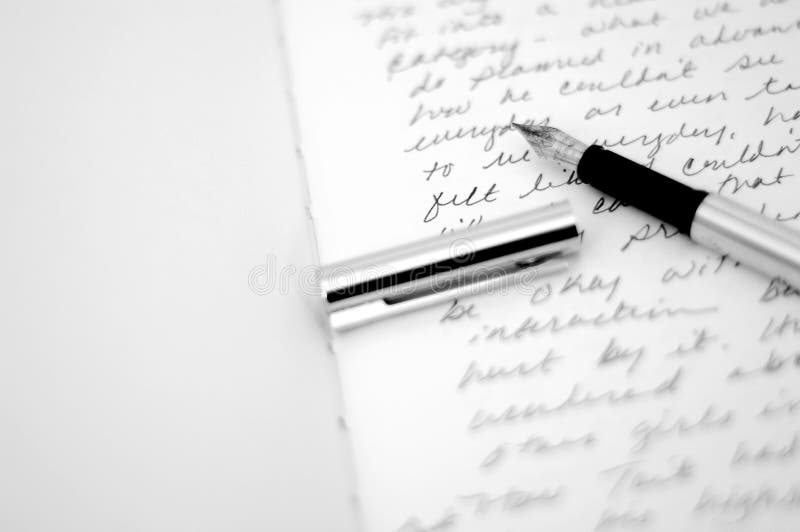 Diary with a blank page and a hand-written page, with an uncapped fountain pen and the cap laying beside it. Diary with a blank page and a hand-written page, with an uncapped fountain pen and the cap laying beside it.