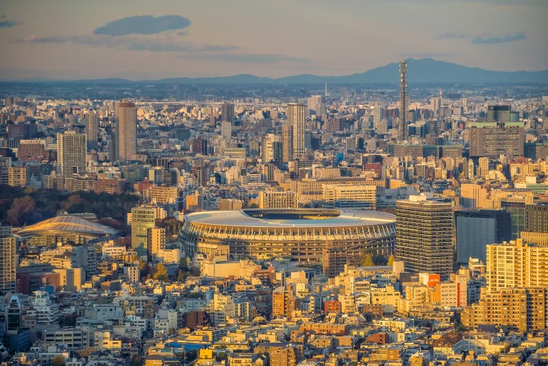 TOKYO, JAPAN - DECEMBER 5, 2019: The New National Stadium, Olympic Stadium in Tokyo, Japan from topview at sunset. TOKYO, JAPAN - DECEMBER 5, 2019: The New National Stadium, Olympic Stadium in Tokyo, Japan from topview at sunset