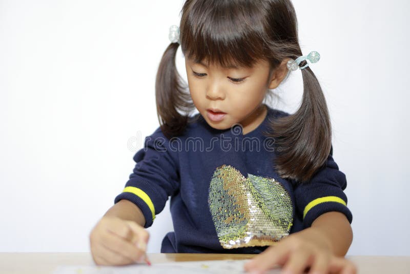 日本女孩画着色素书 库存照片