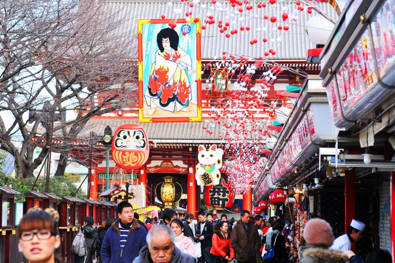 Tokyo, Japan - 31 December, 2011: Crowds of people at Sensoji temple market on New Year's Eve in Asakusa, Yokyo. Tokyo, Japan - 31 December, 2011: Crowds of people at Sensoji temple market on New Year's Eve in Asakusa, Yokyo