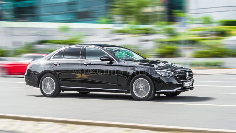 Moscow, Russia - July 2021: Mercedes E Class W213 car in motion on the road on sunny spring day in city. Moscow, Russia - July 2021: Mercedes E Class W213 car in motion on the road on sunny spring day in city