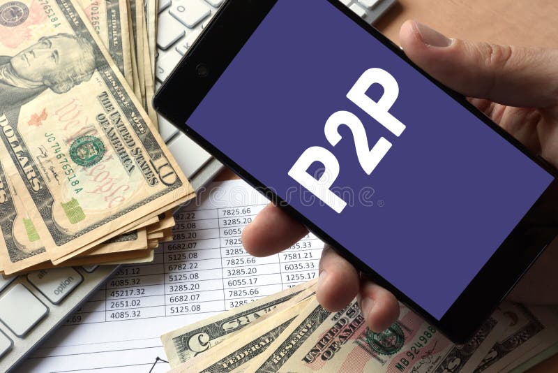 Smartphone in hand with message P2P. Peer to peer lending concept. Smartphone in hand with message P2P. Peer to peer lending concept