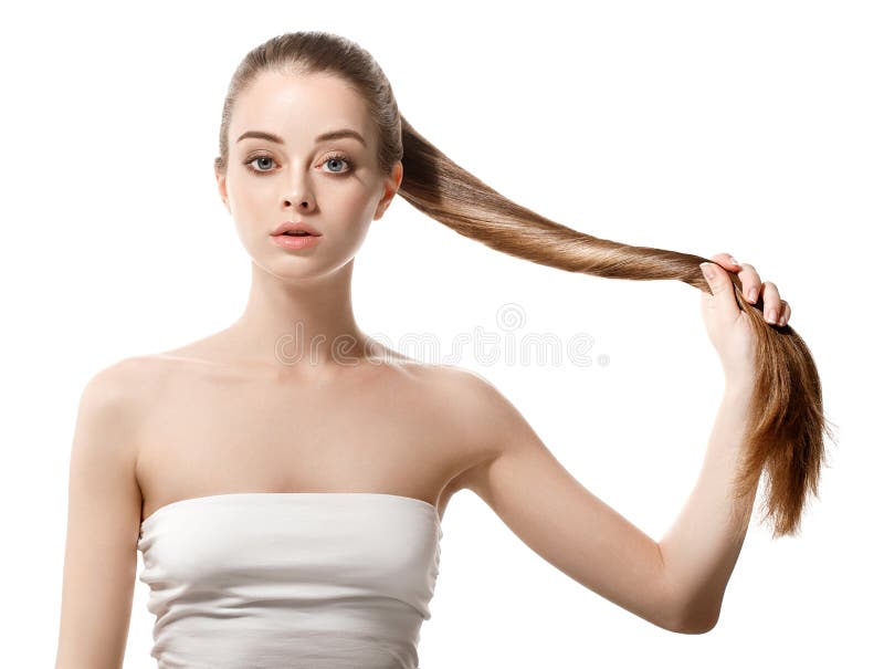 有健康长的头发的美丽的妇女保持头发手中与自然组成 库存图片 有健康长的头发的美丽的妇女保持头发手中与自然组成 库存图片