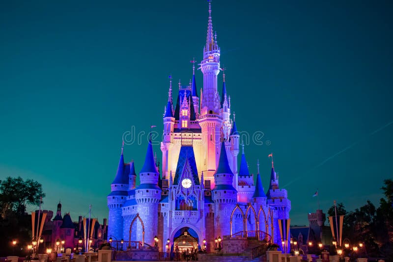 Orlando, Florida. April 02, 2019. Panoramic view of illuminated Cinderella`s Castle on blue night background in Magic Kingdom at Walt Disney World 2. Orlando, Florida. April 02, 2019. Panoramic view of illuminated Cinderella`s Castle on blue night background in Magic Kingdom at Walt Disney World 2