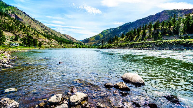 Thompson River with its many rapids flowing through the Canyon in the Coastal Mountain Ranges of British Columbia, Canada. Thompson River with its many rapids flowing through the Canyon in the Coastal Mountain Ranges of British Columbia, Canada