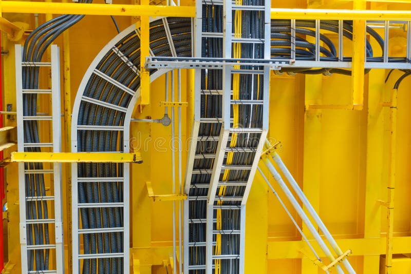 Cable tray with electrical wiring arrange on ceiling at offshore platform. Cable tray with electrical wiring arrange on ceiling at offshore platform.