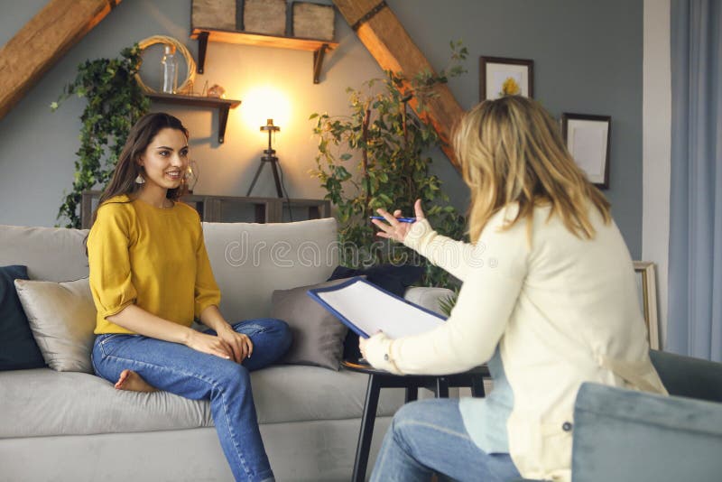 Psychologist having session with her female patient in her private consulting room. Psychologist having session with her female patient in her private consulting room