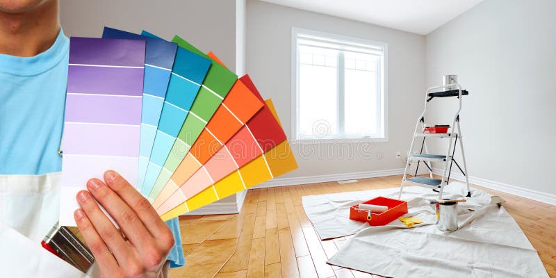 Professional man painter hand with colors. House renovation. Professional man painter hand with colors. House renovation