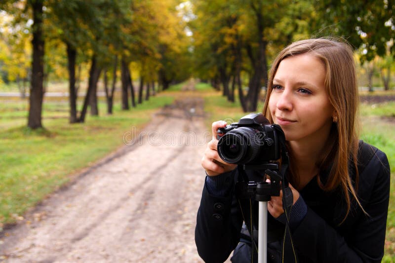 Woman the photographer on the nature. Woman the photographer on the nature