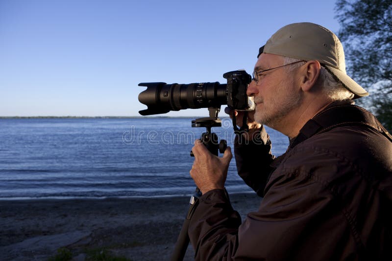 Nature or landscape Photographer in action. Nature or landscape Photographer in action