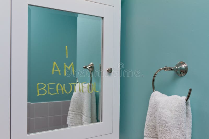 Positive self image or body image concept - I am beautiful written on mirror in bathroom. Positive self image or body image concept - I am beautiful written on mirror in bathroom