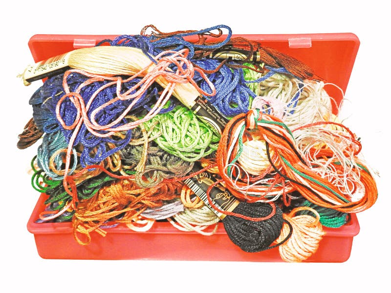 photo of a craft box full of messy coloured threads and yarn waiting to be sorted and tidied up into neat skeins of wool. photo of a craft box full of messy coloured threads and yarn waiting to be sorted and tidied up into neat skeins of wool.