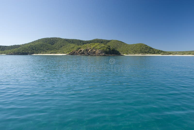 A lone yacht moored off great keppel island, queensland, australia. A lone yacht moored off great keppel island, queensland, australia