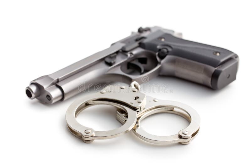 Gun and handcuffs on white background. Gun and handcuffs on white background