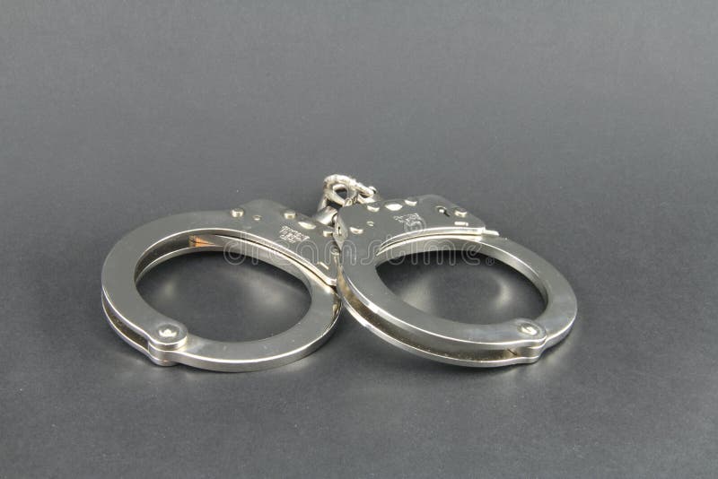 Hand cuffs isolated with copy space. Hand cuffs isolated with copy space.