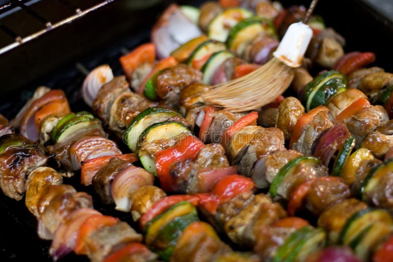 Beef shish kebabs on skewers, cooking on the grill. Beef shish kebabs on skewers, cooking on the grill.