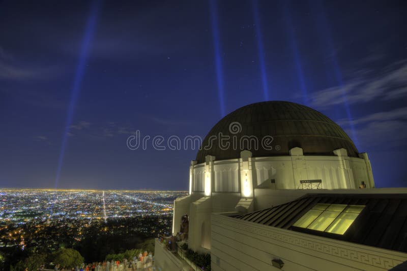 Griffith Observatory at night with spot lights aimed toward the sky. Griffith Observatory at night with spot lights aimed toward the sky.