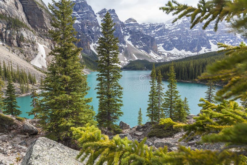 Moraine Lake, a glacially-fed lake in Banff National Park, Alberta, Canada, situated in the Valley of the Ten Peaks. Surrounded by the snow covered peaks of the Rocky Mountains. Moraine Lake, a glacially-fed lake in Banff National Park, Alberta, Canada, situated in the Valley of the Ten Peaks. Surrounded by the snow covered peaks of the Rocky Mountains.