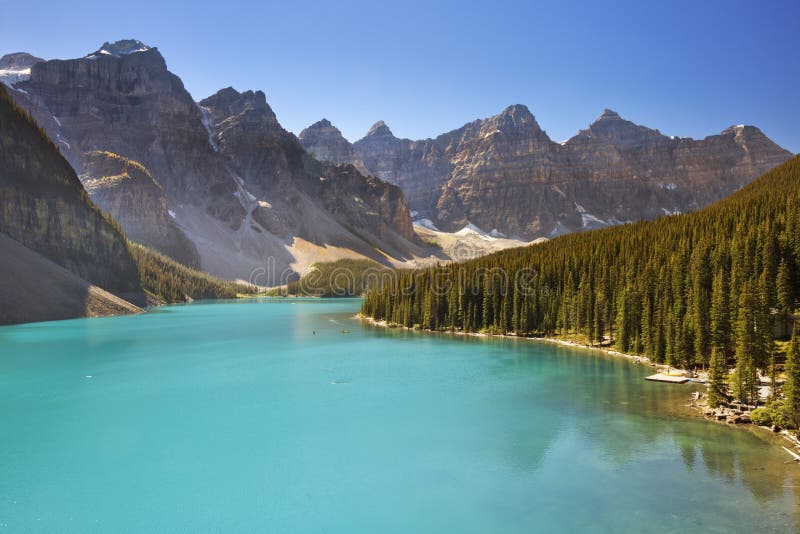 Moraine Lake in Banff National Park, Canada. Photographed on a beautiful sunny day with a clear blue sky. Moraine Lake in Banff National Park, Canada. Photographed on a beautiful sunny day with a clear blue sky.