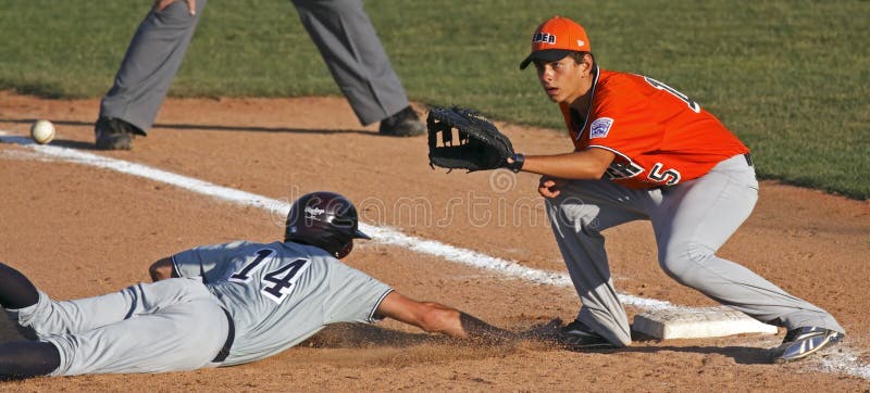 BANGOR, MAINE - AUGUST 15: Davis Atkins of U.S. Southwest (West University L.L., Houston, Texas) slides back to first as Valerio Lucini of Europe-Middle East-Africa (Lazio, Italy) awaits the ball at the 2010 Senior League Baseball World Series on August 15, 2010 in Bangor, Maine. BANGOR, MAINE - AUGUST 15: Davis Atkins of U.S. Southwest (West University L.L., Houston, Texas) slides back to first as Valerio Lucini of Europe-Middle East-Africa (Lazio, Italy) awaits the ball at the 2010 Senior League Baseball World Series on August 15, 2010 in Bangor, Maine.