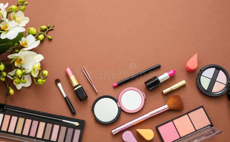 Makeup natural cosmetic products against brown color background. Make up female accessories, flat lay, top view, copy space. Makeup natural cosmetic products against brown color background. Make up female accessories, flat lay, top view, copy space