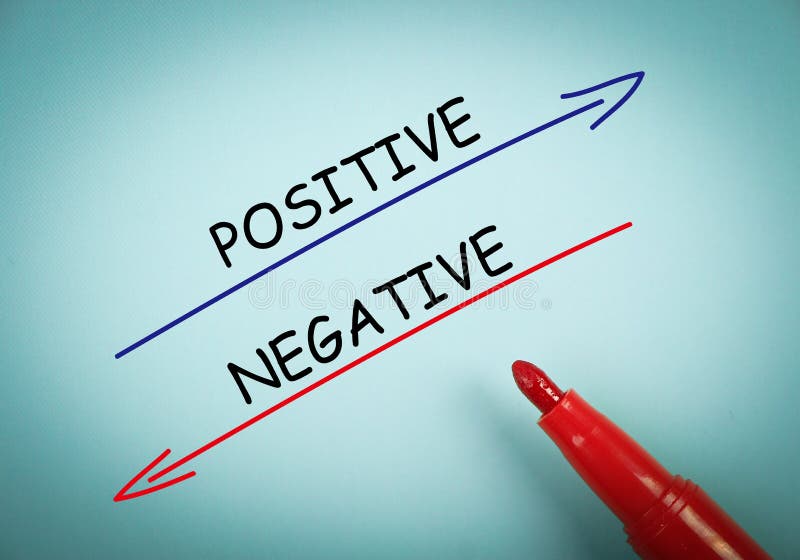 Positive and negative concept is on blue paper with a red marker aside. Positive and negative concept is on blue paper with a red marker aside.